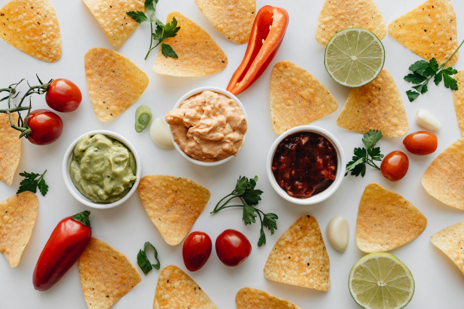 Vibrant Mexican food spread featuring nachos and dips, perfect for celebrations.